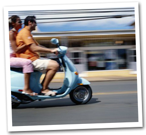 People carrying surfboards